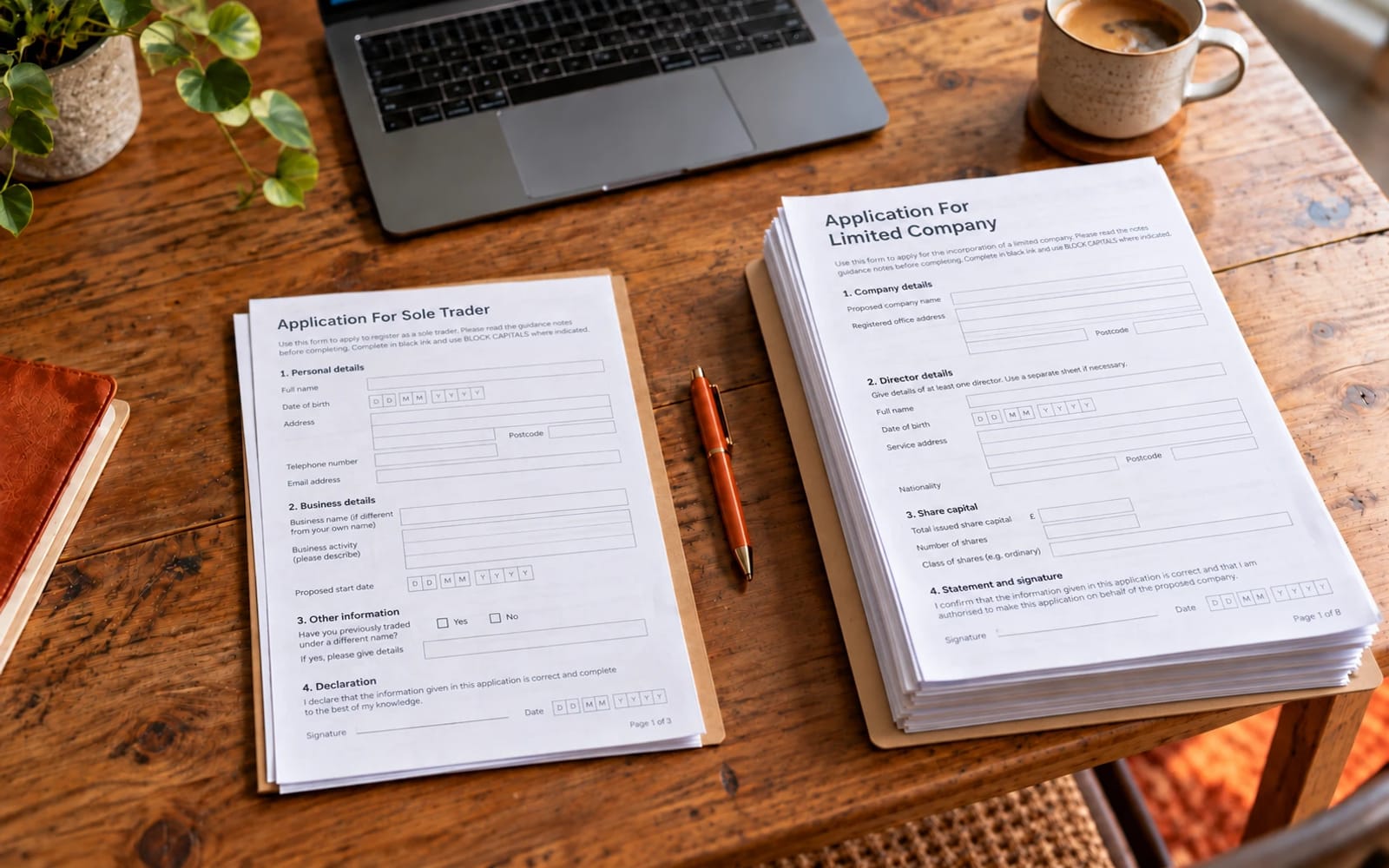 A sole trader application form and a limited company application form side by side on a desk with a pen between them