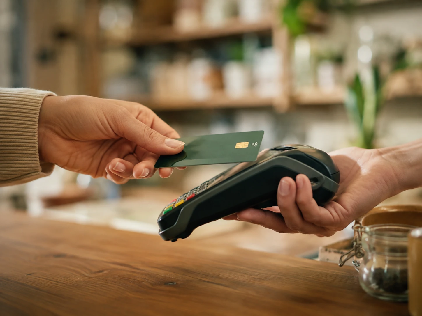 A contactless card payment at a shop counter